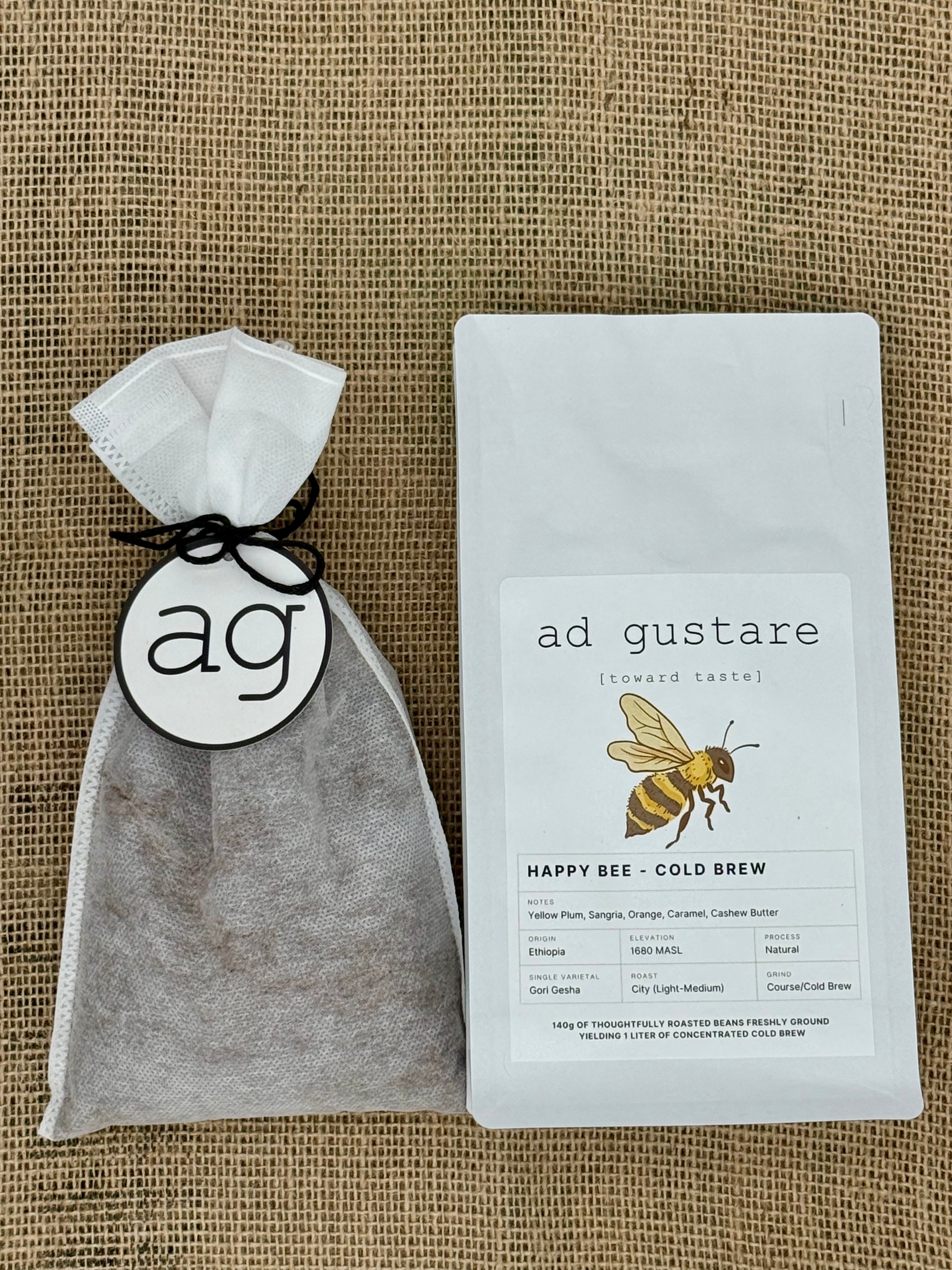 ad gustare Happy Bee cold brew sachet bag on textured background